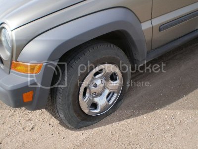 Flat%20Tire%20Jeep%20KJ.jpg