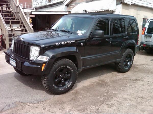 IMG00026 20090327 1421
Painted stock rims flat black with duplicolor rim paint. Also installed a winch bar/pre runner for front protection.